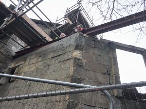 Builders on the extension putting up the steels