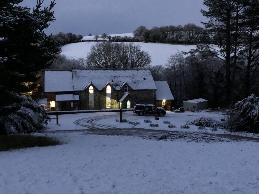 The Chapel Glowing in the Snow